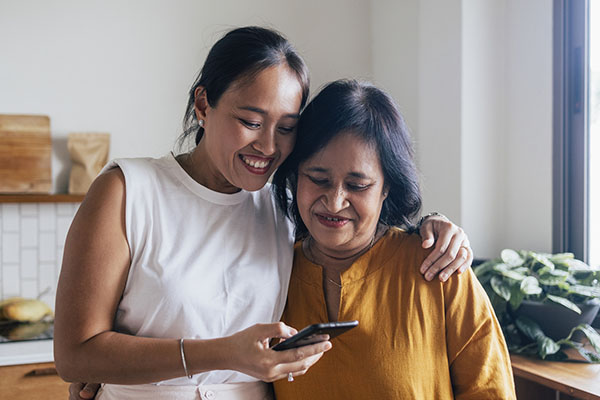 Woman and mother staring at a mobile phone screen